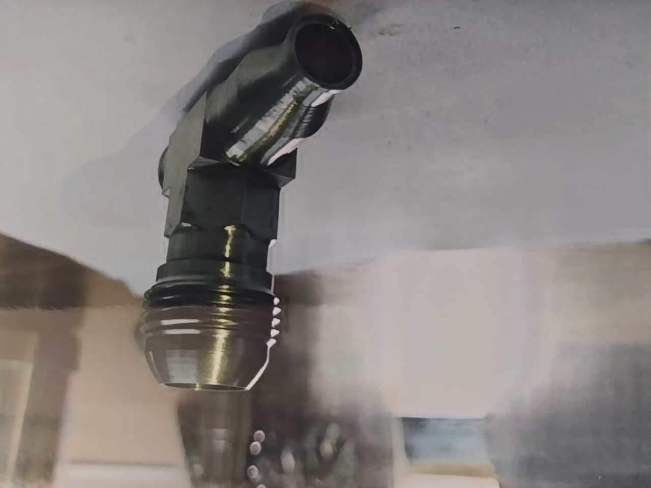 Angled machined nozzle component